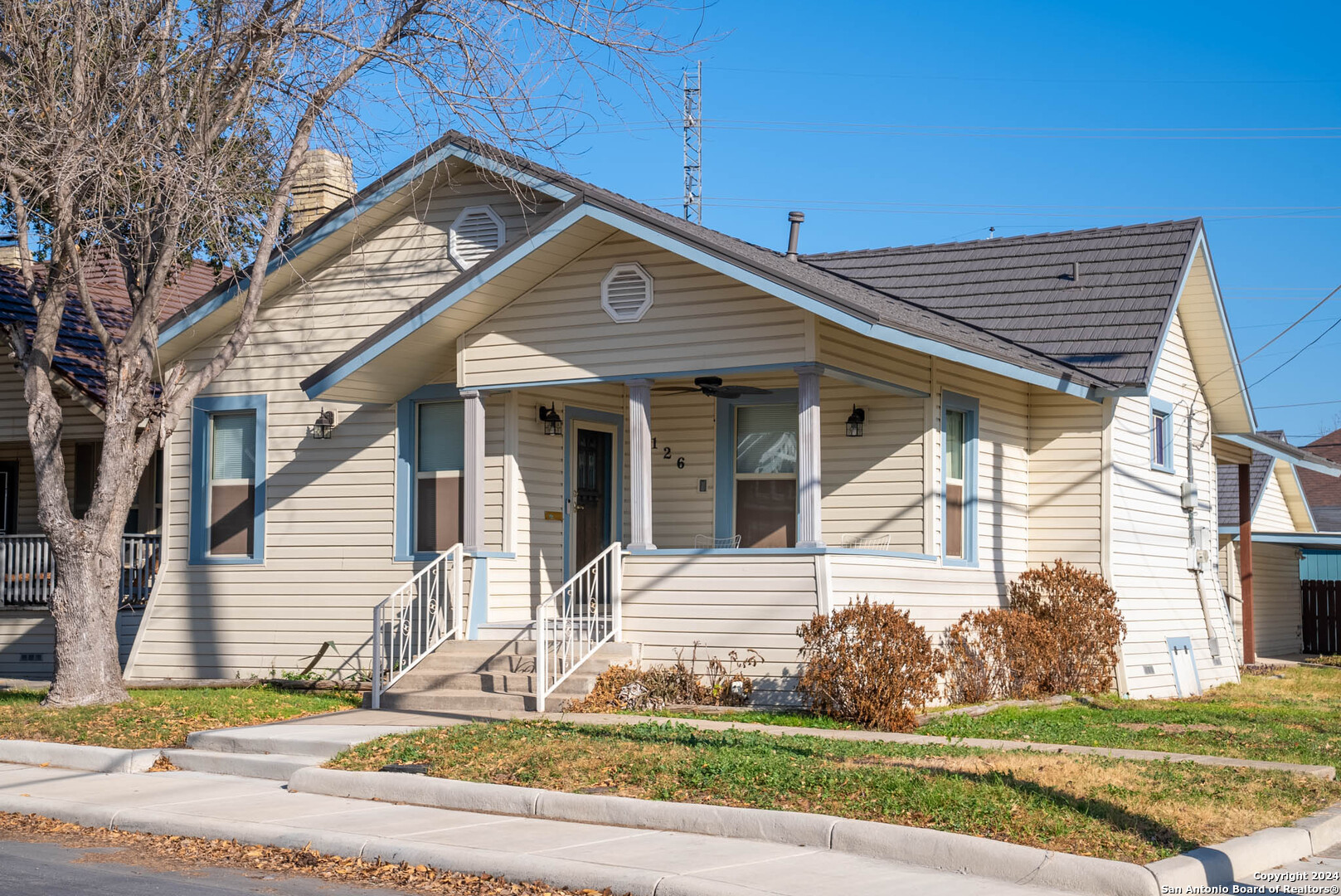 a front view of a house with a yard