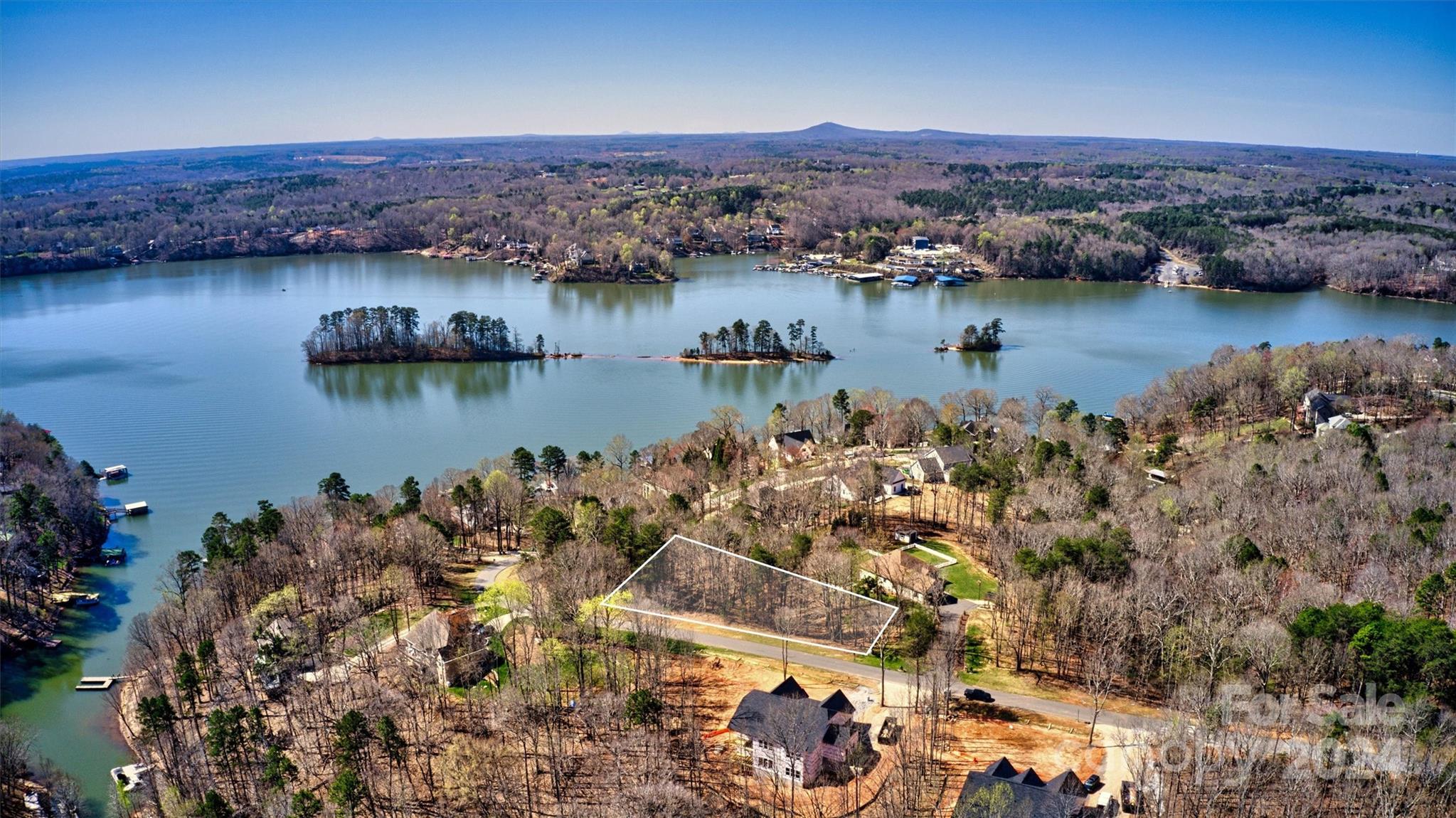 an aerial view of a houses with a lake view