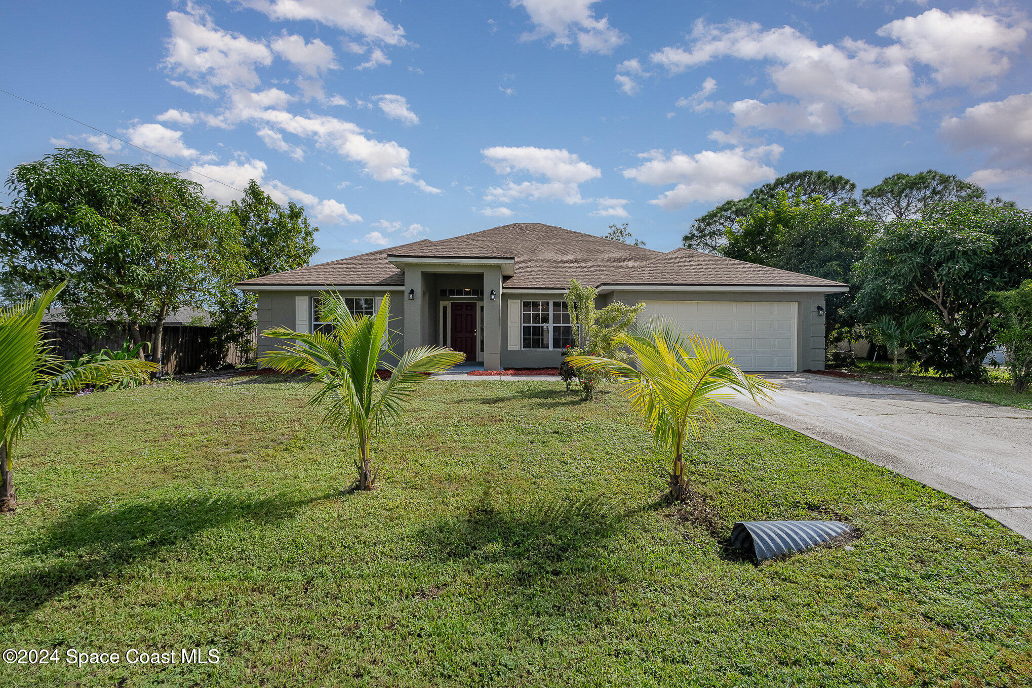 front view of a house with a yard