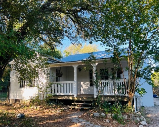 a view of a house with a small yard