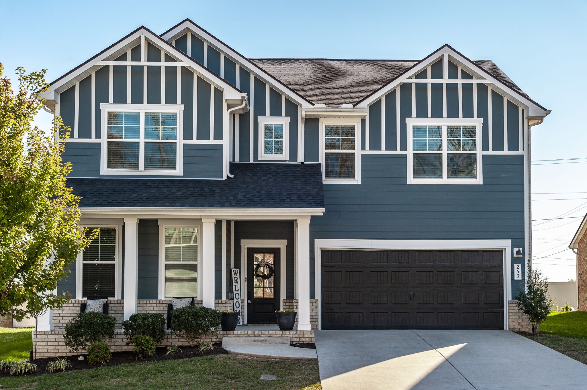 front view of residential house with a yard