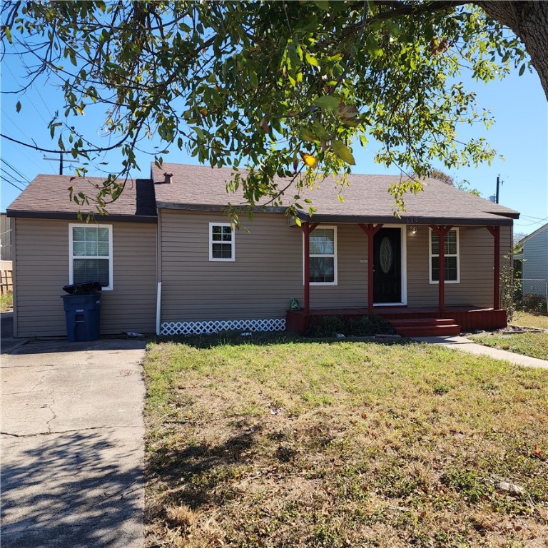 a house with yard in front of it