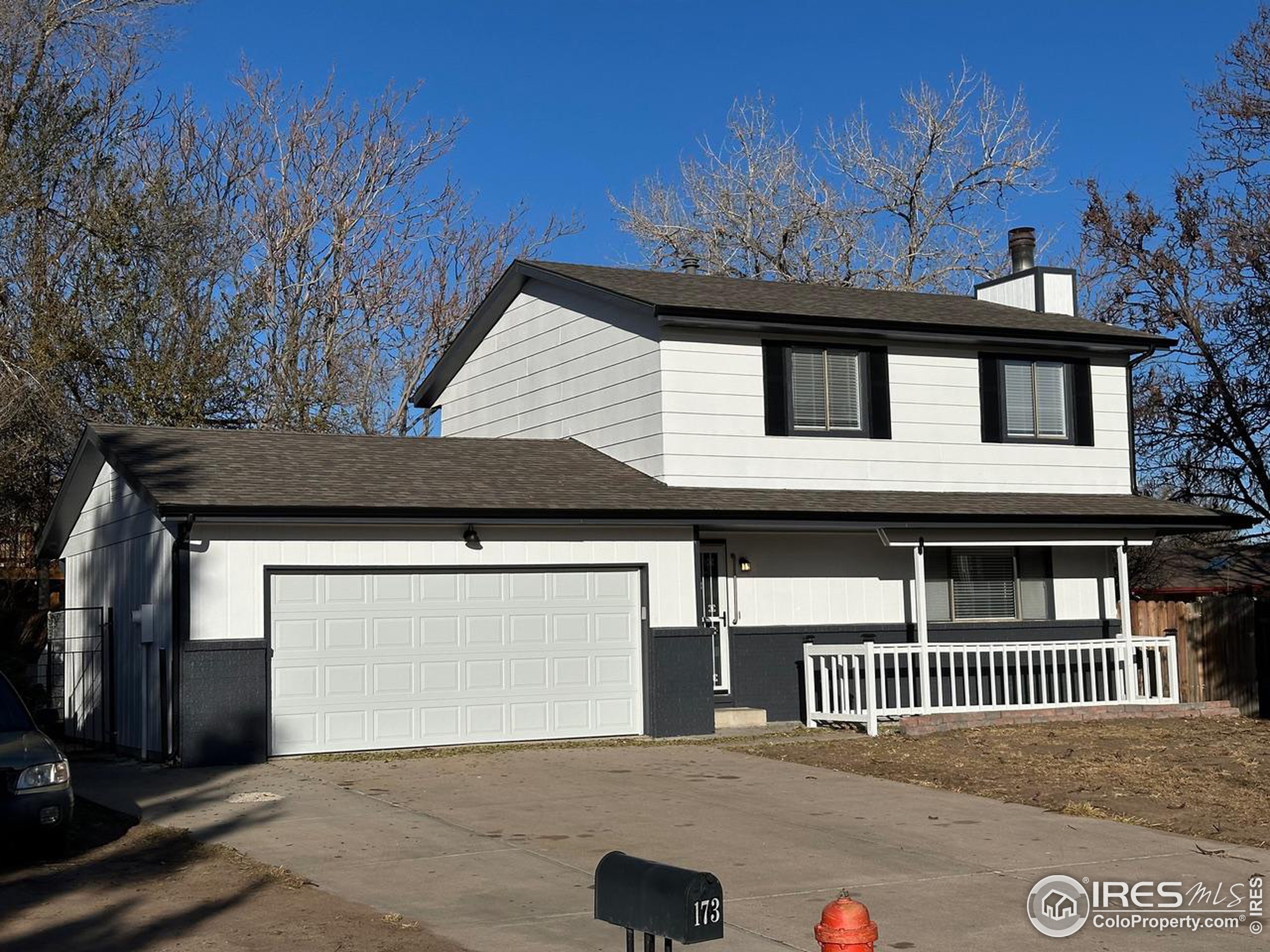 a front view of a house with a garage