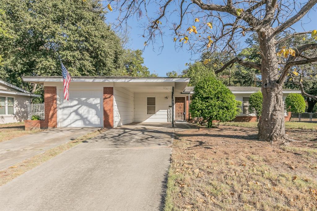 front view of a house with a trees