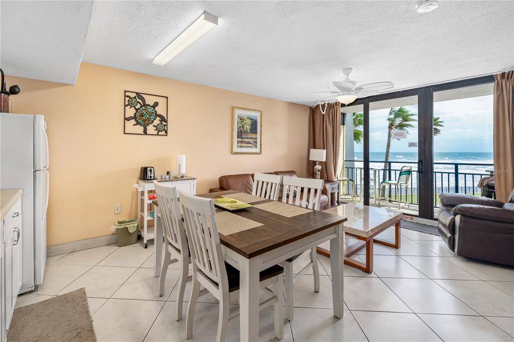 a dining room with a table and chairs