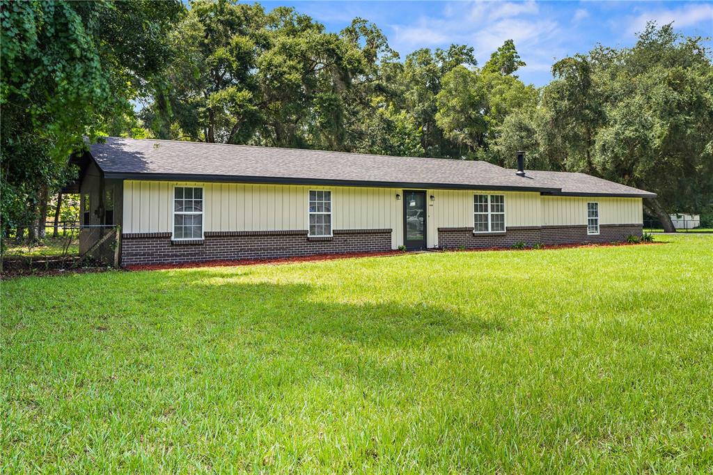 front view of a house with a yard