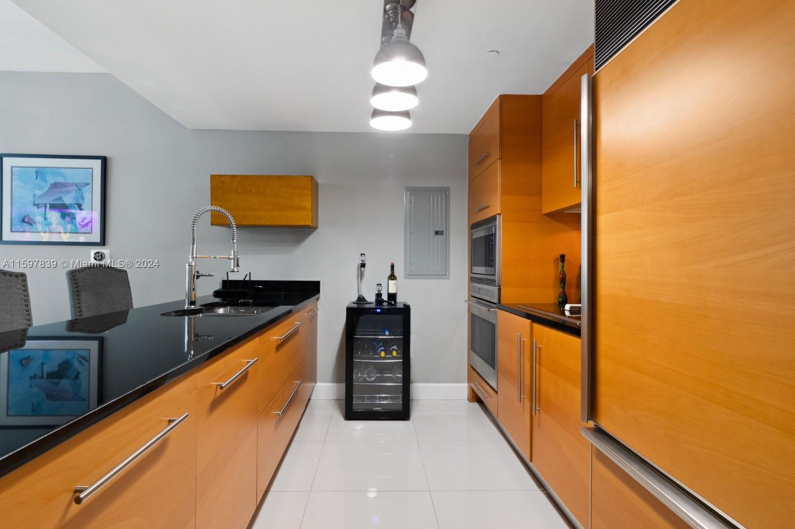 a kitchen with stainless steel appliances granite countertop a stove and a refrigerator