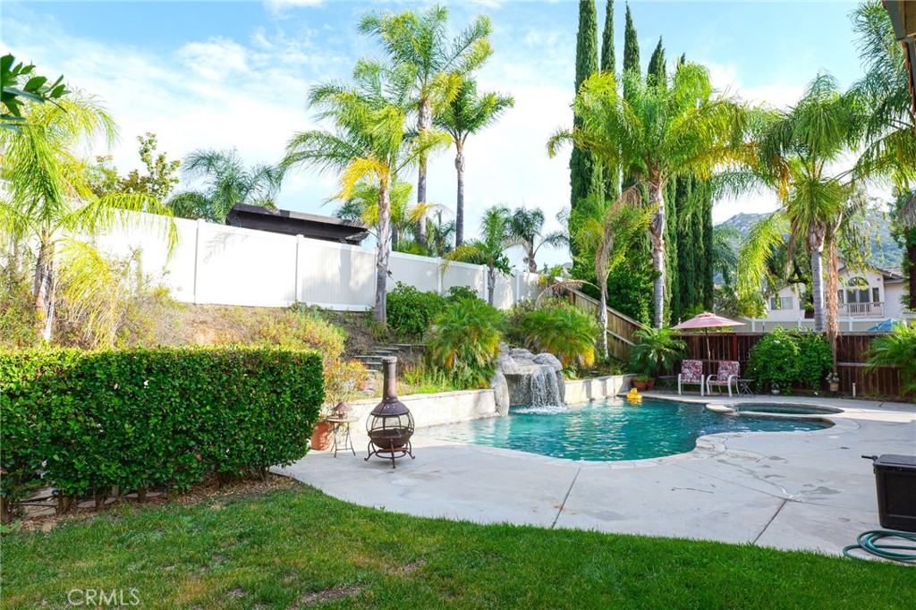 a view of a backyard with a garden and plants