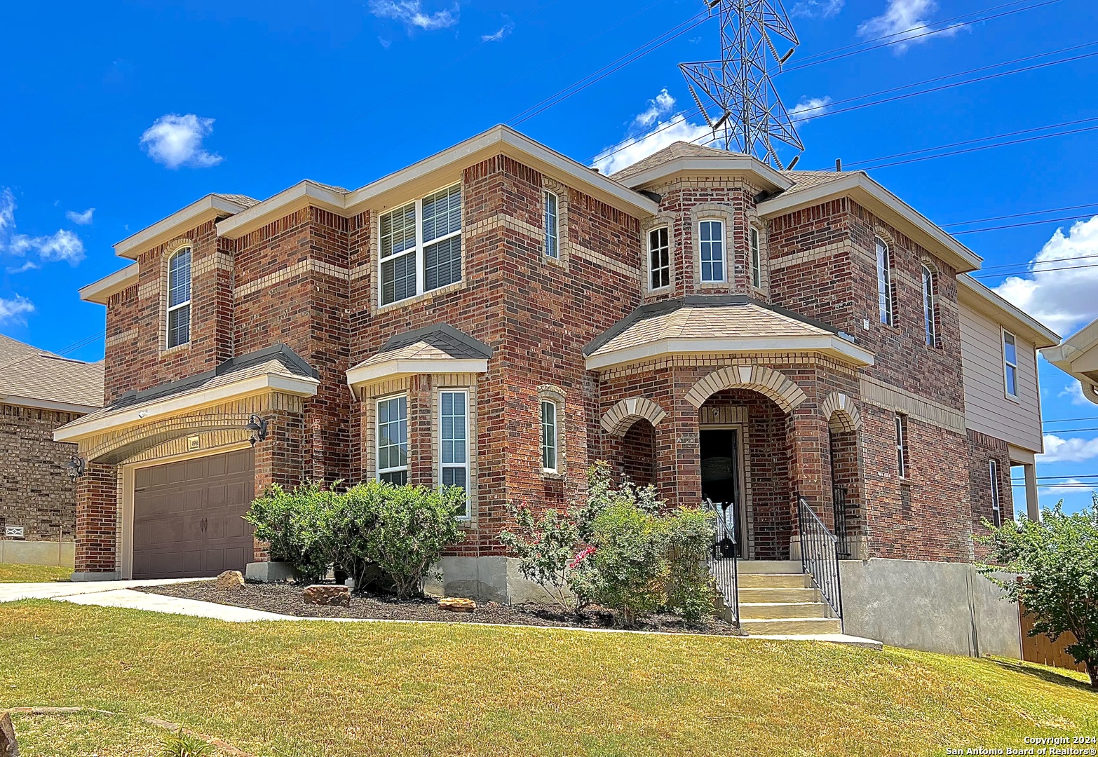 a front view of a house with a yard