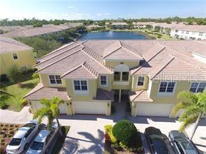 a aerial view of a house with swimming pool and a yard