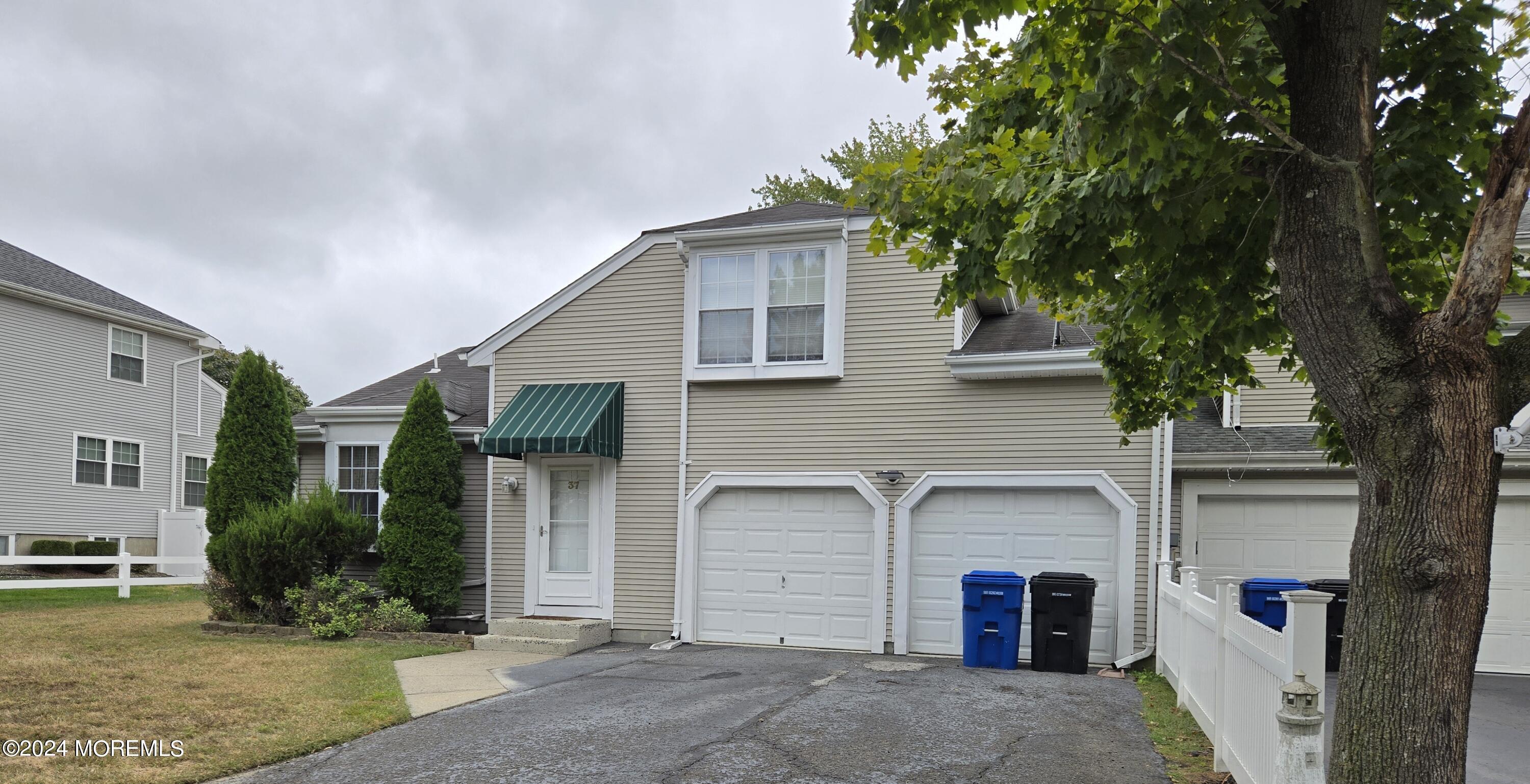 front view of a house with a yard