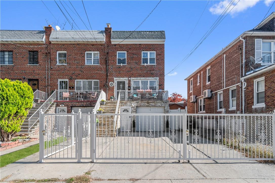 a front view of a house with a fence