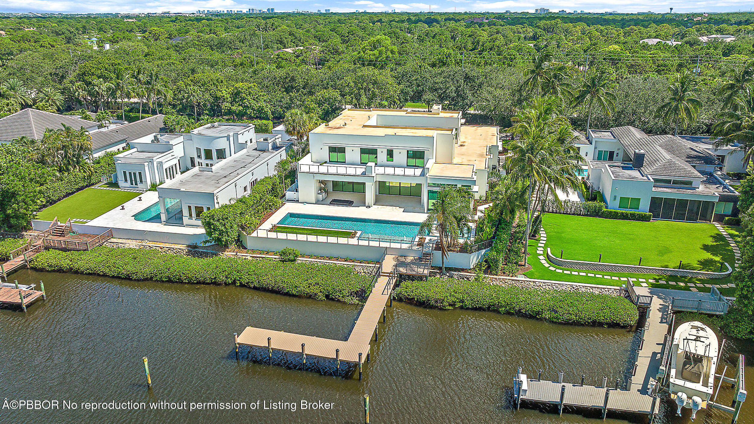 an aerial view of a house with a lake view