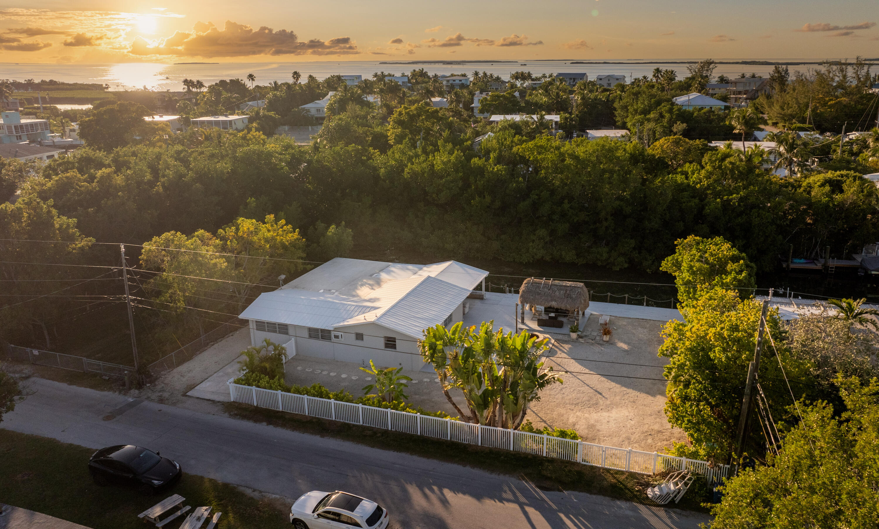 an aerial view of a house with a yard lake view