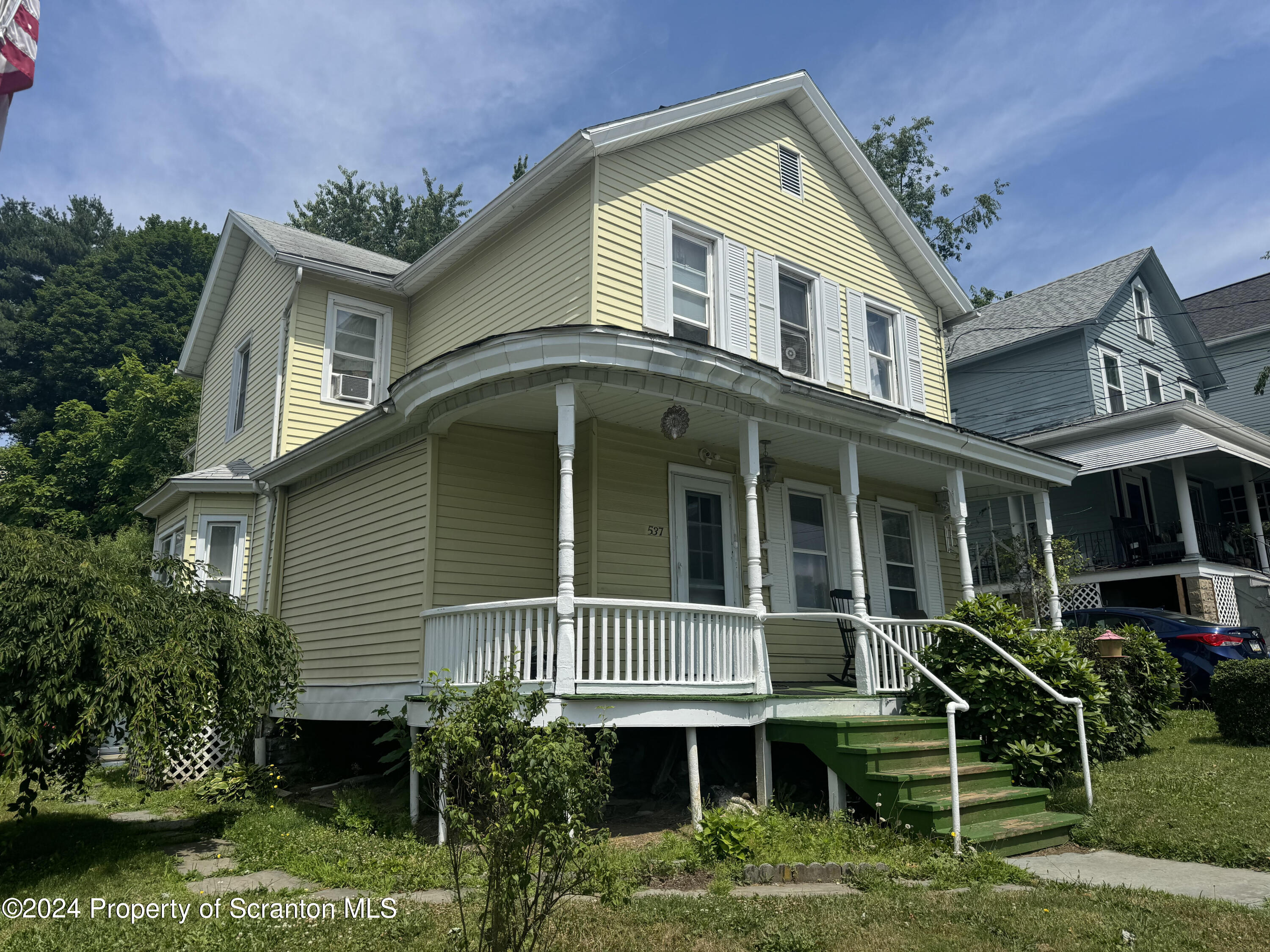 a front view of a house with a porch