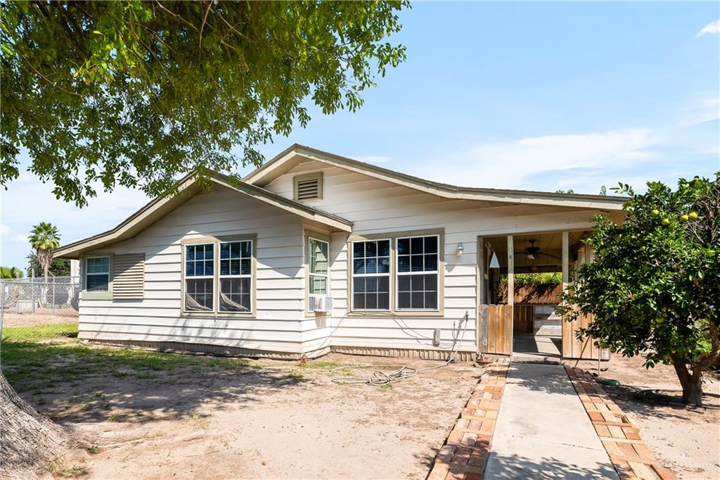 View of front of house featuring ceiling fan