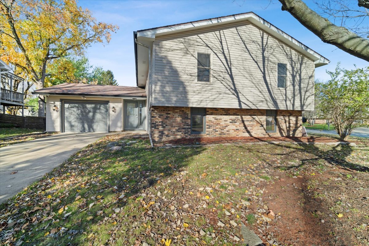 front view of a house with a large window