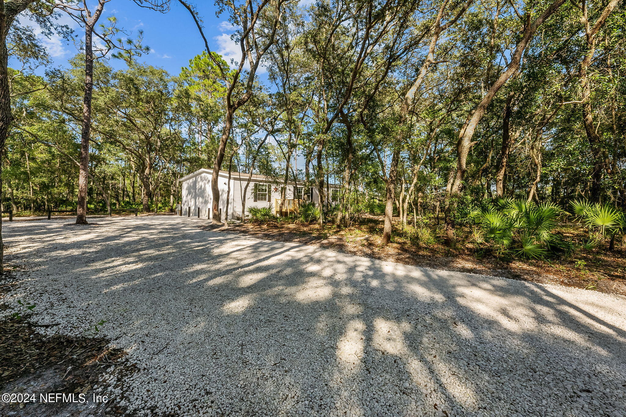 a view of backyard with green space