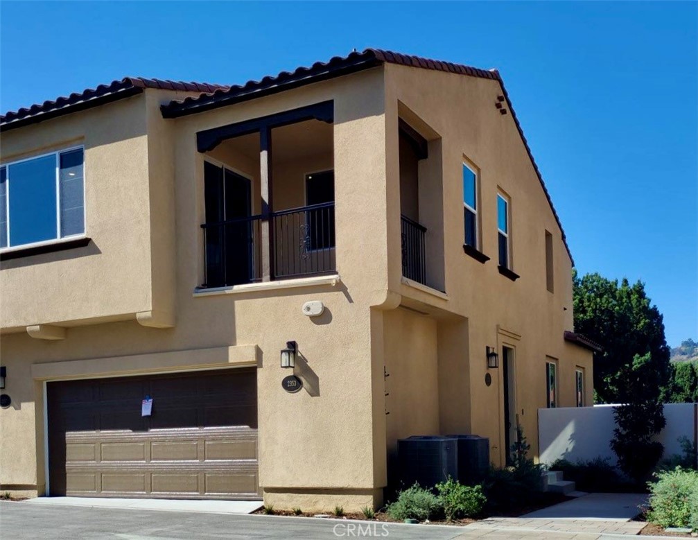 a front view of a house with garage