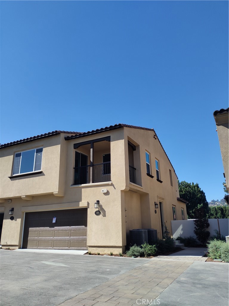 a front view of a house with a garage