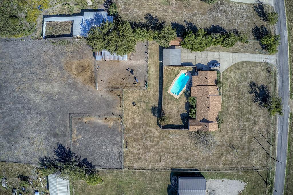 an aerial view of a house with outdoor space