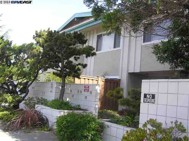 a view of a house with a tree