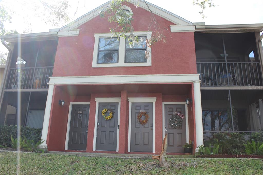 a front view of a house with yard