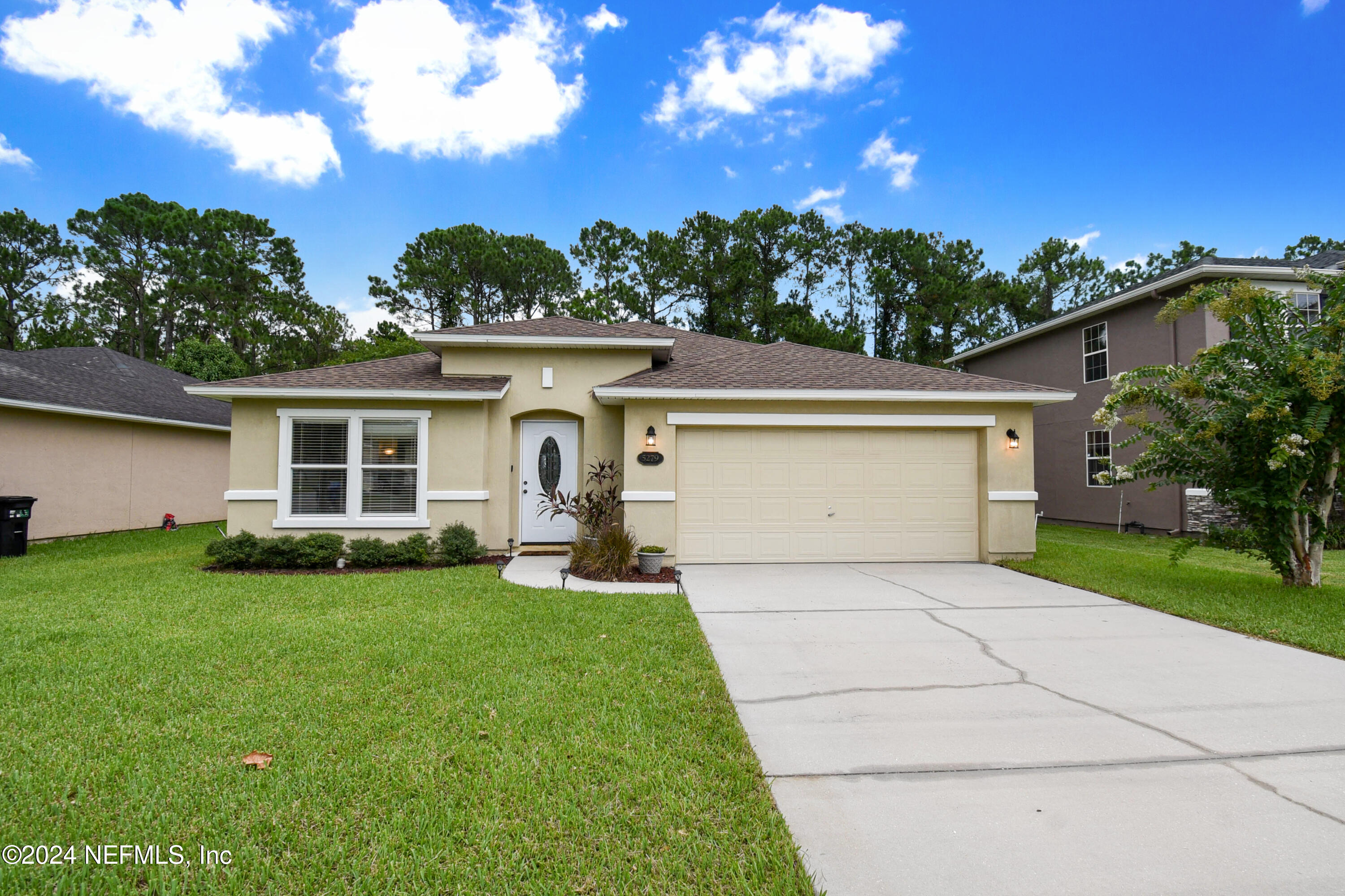 front view of a house with a yard