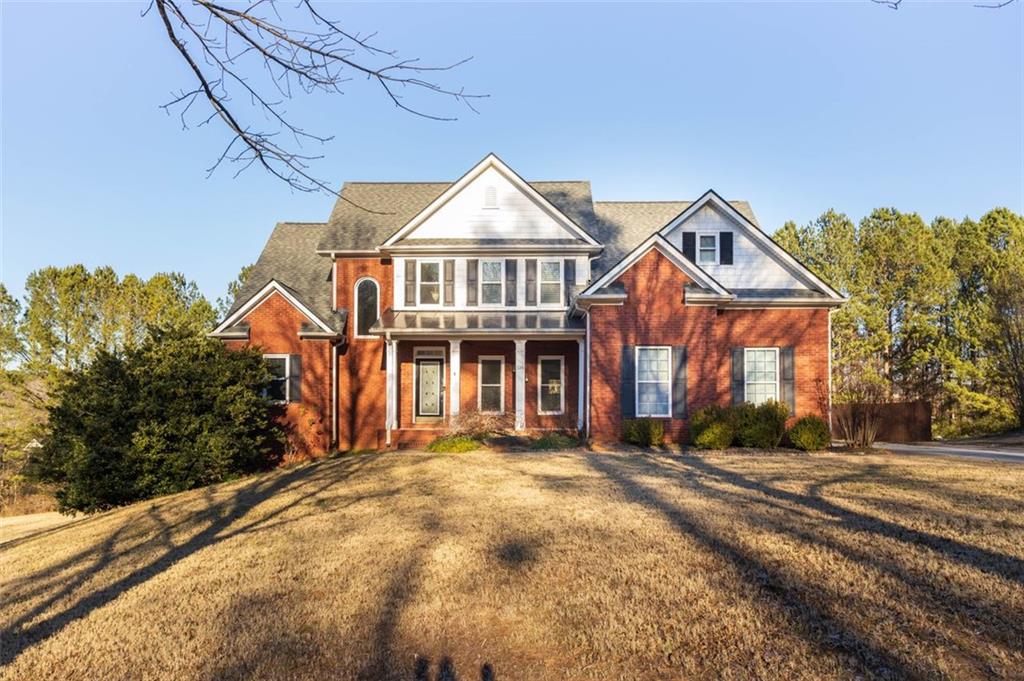 a front view of a house with a yard