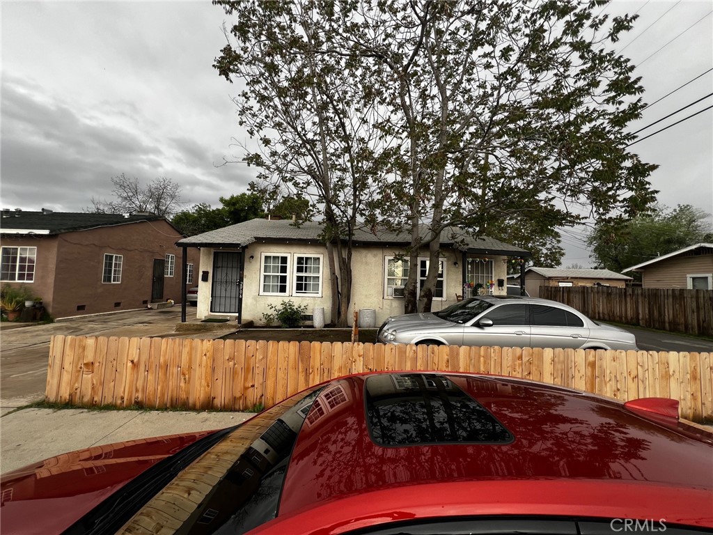 a front view of house with yard outdoor seating and barbeque oven