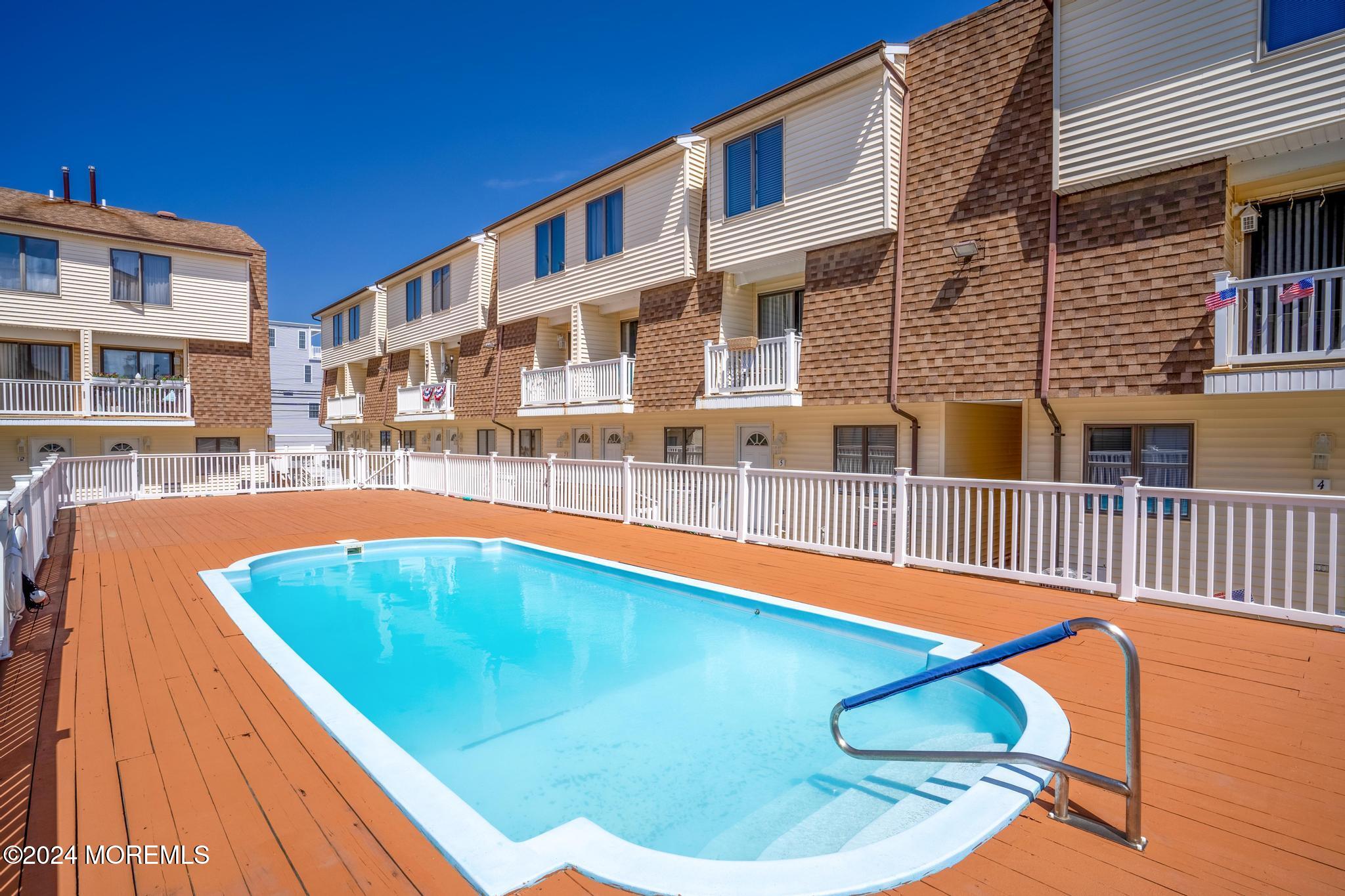 a view of a swimming pool with a lounge chairs