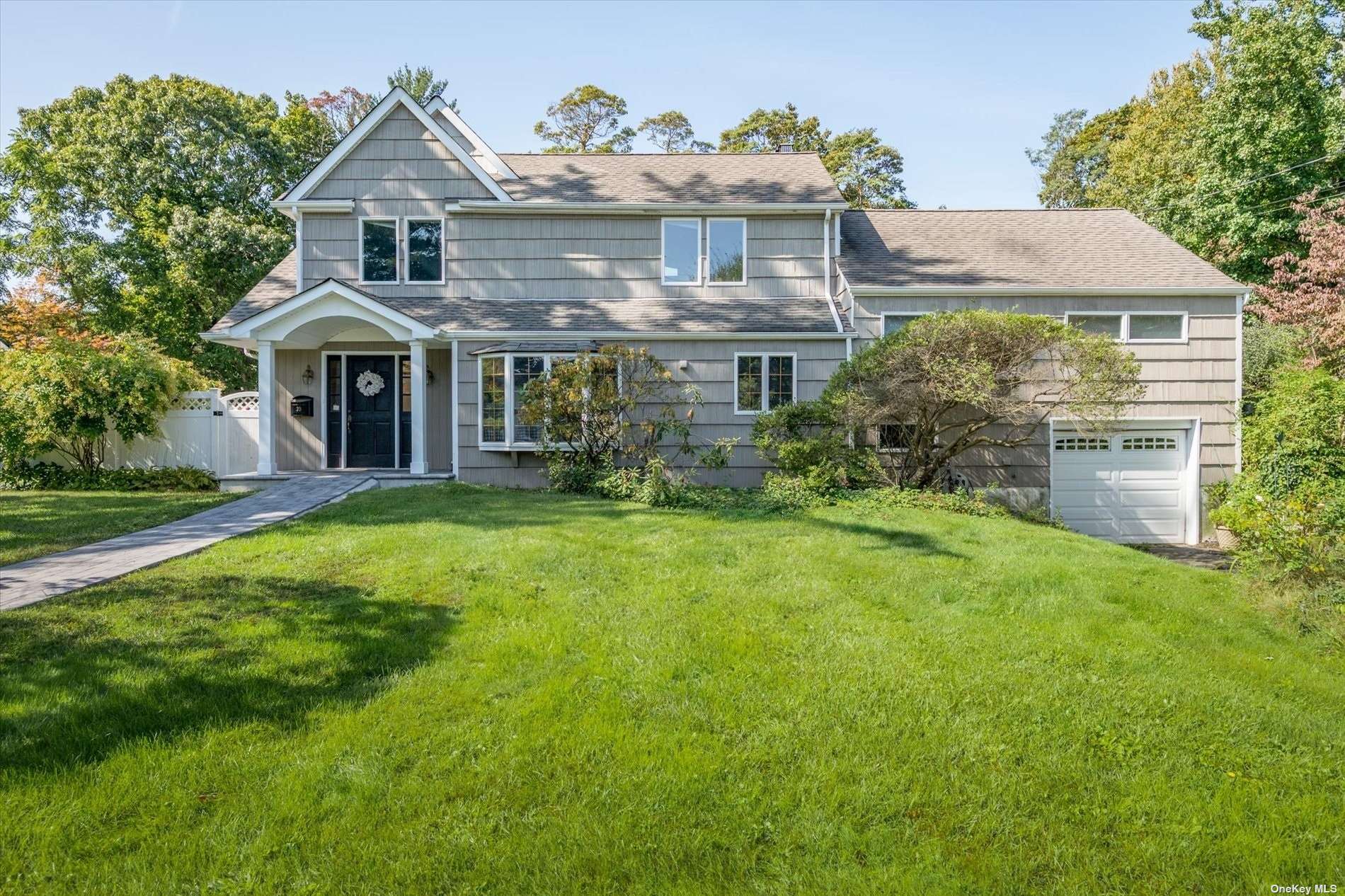 a view of a brick house with a yard