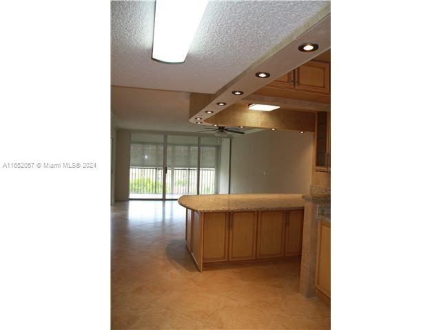 a picture of a room with a sink and a large window