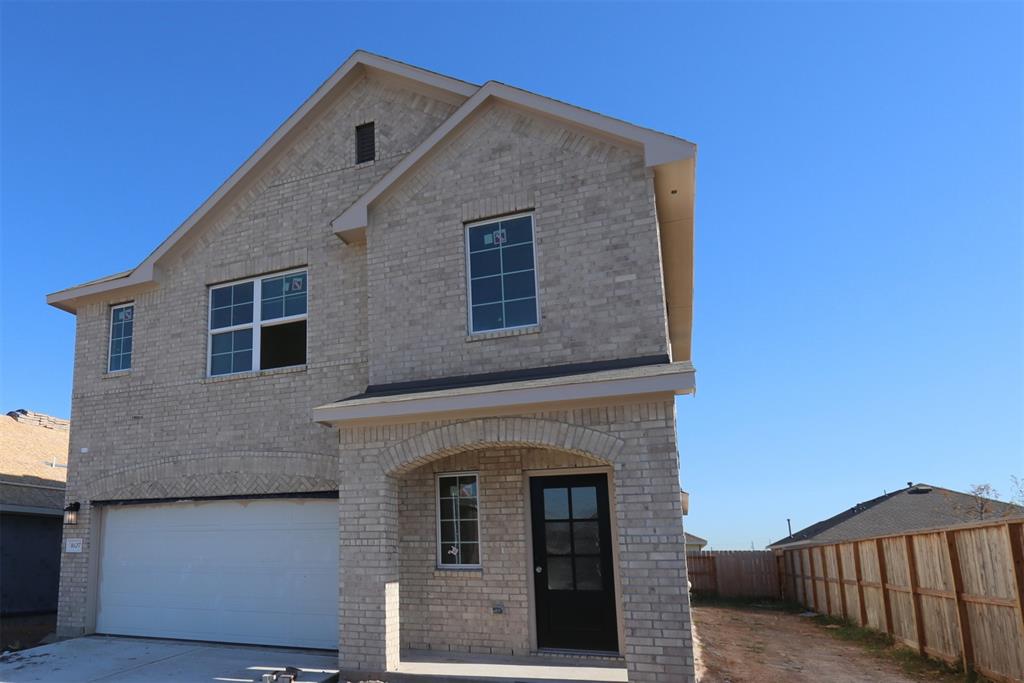 a front view of a house with garage