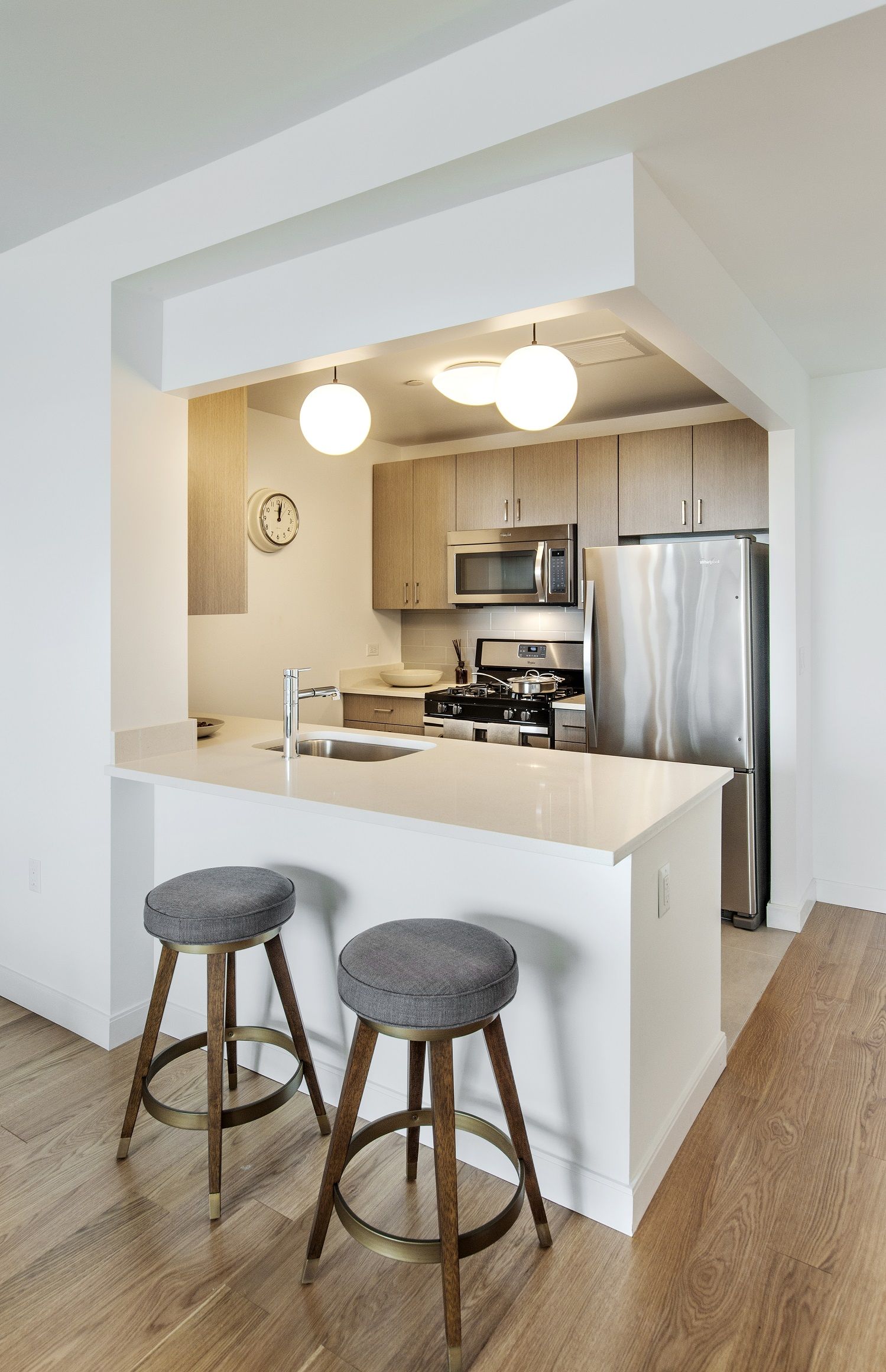 a kitchen with a table chairs sink and cabinets