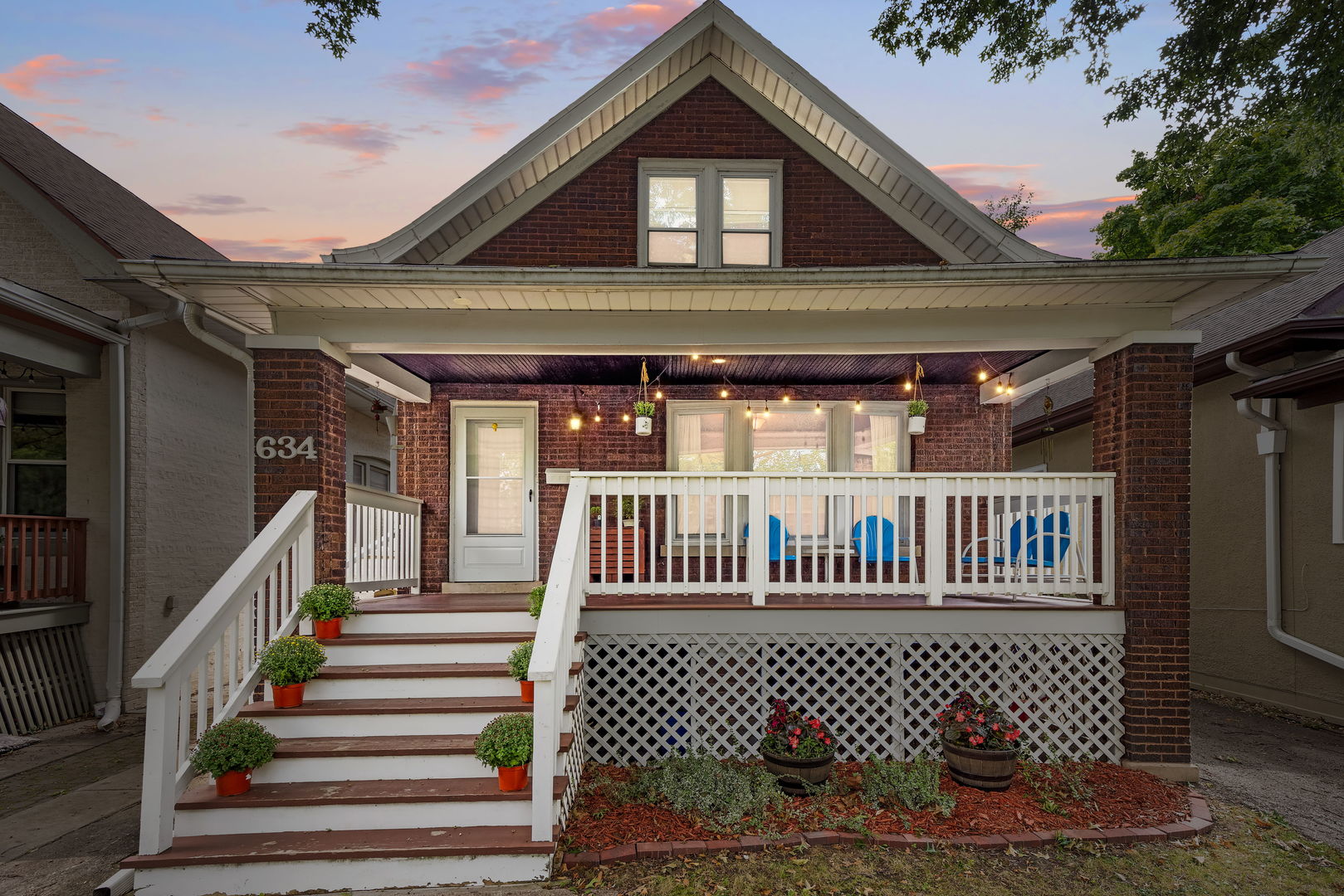 a front view of a house with wooden fence