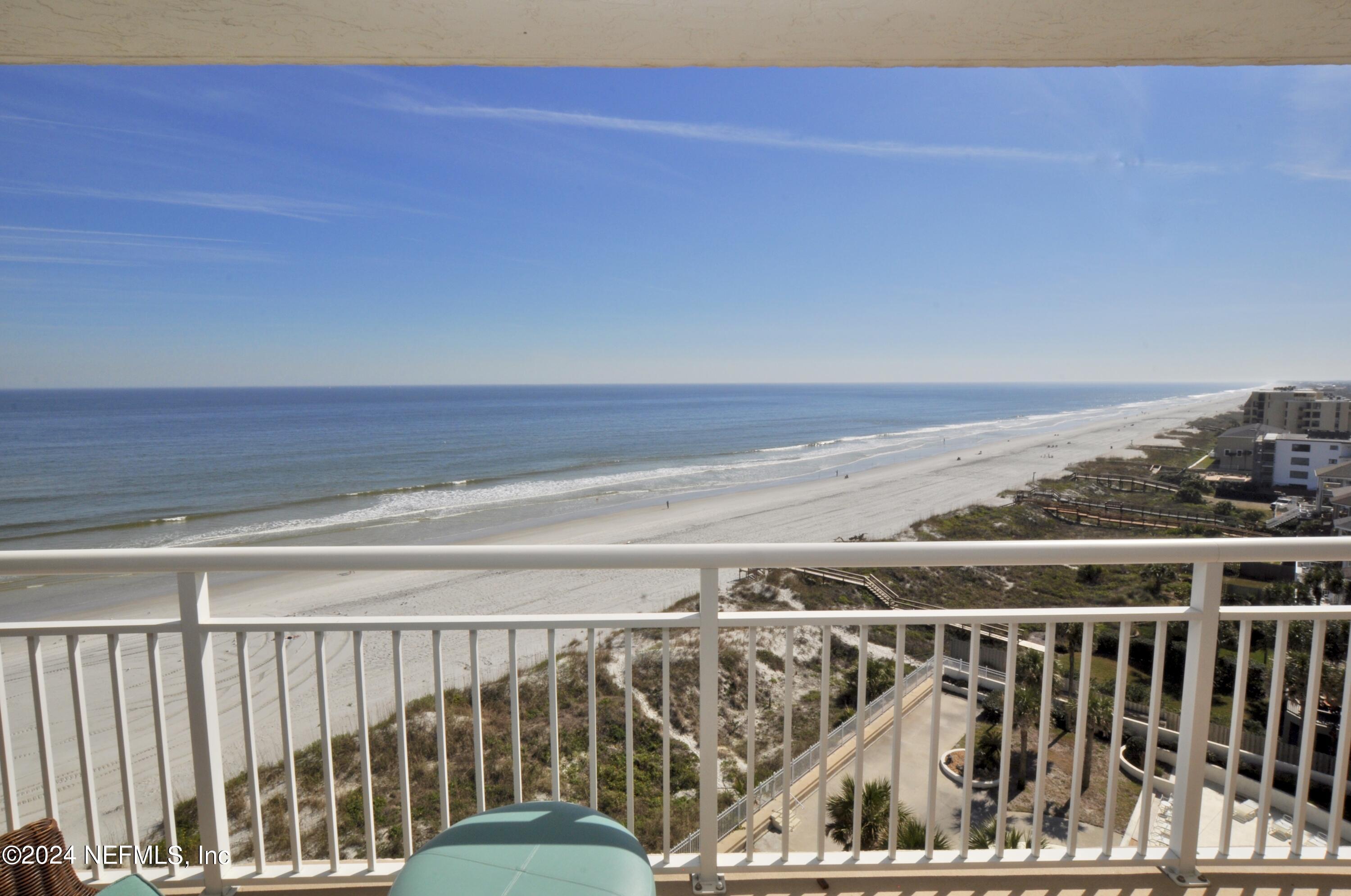 a view of a balcony with ocean view