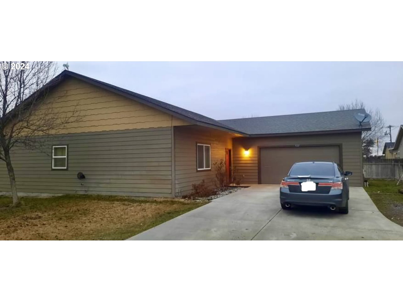 a view of a car parked in back of a house