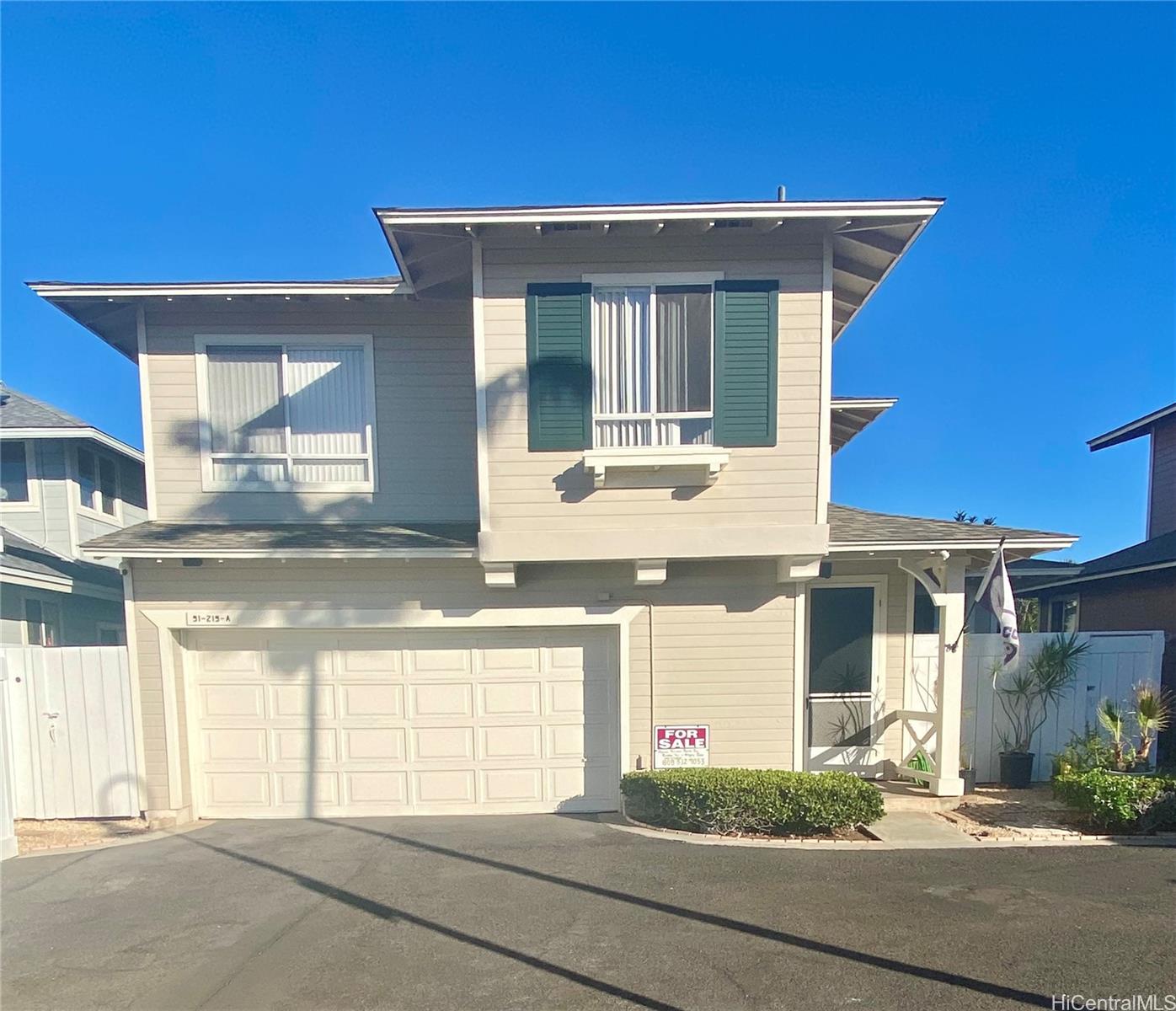 a front view of a house with a garage