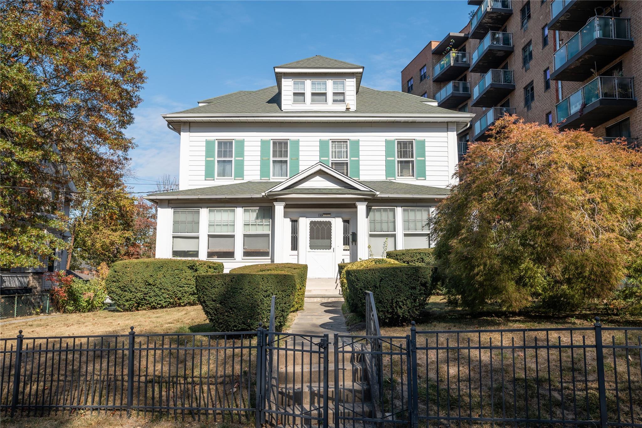 a front view of a house with a yard