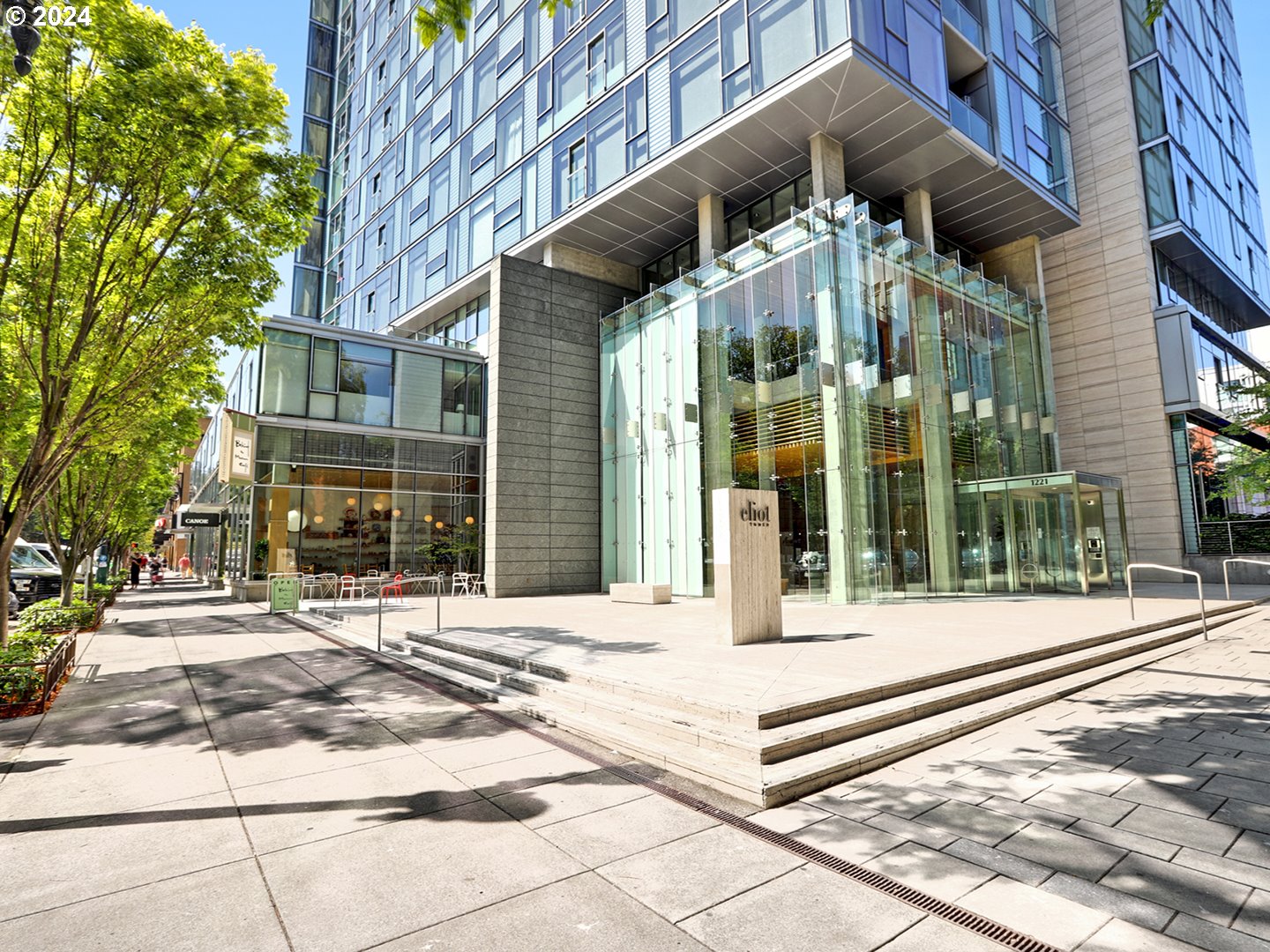 a view of a building with a glass door