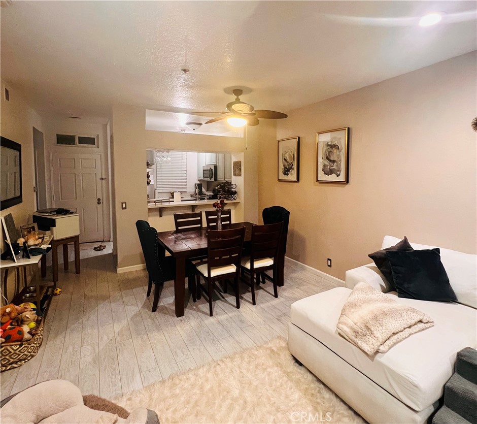 a view of a dining room with furniture and chandelier