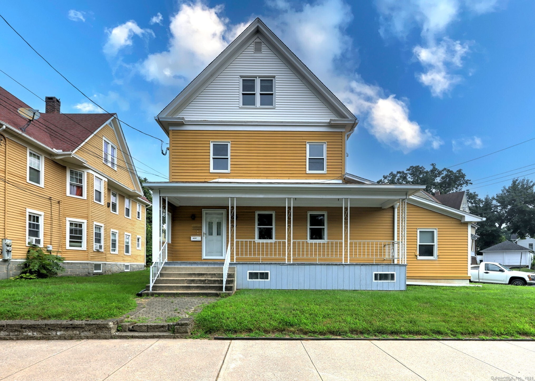 a front view of a house with a yard