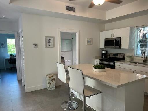 a kitchen with a table and chairs in it