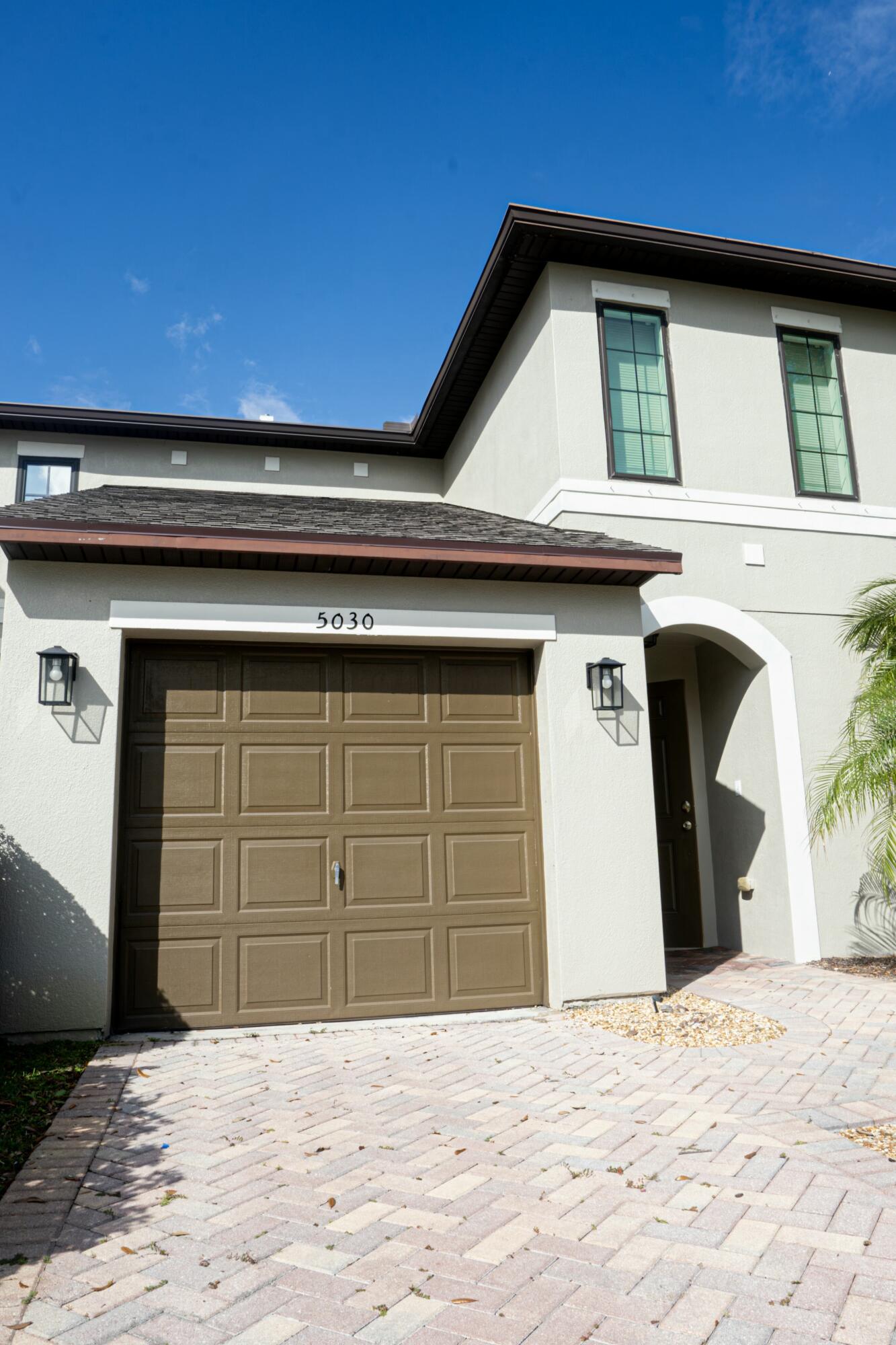 a front view of a house with a garage