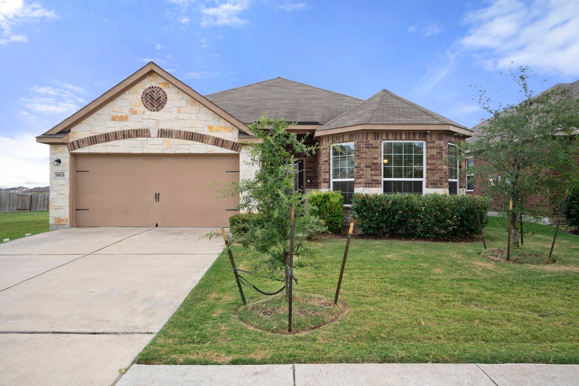 a front view of a house with a yard