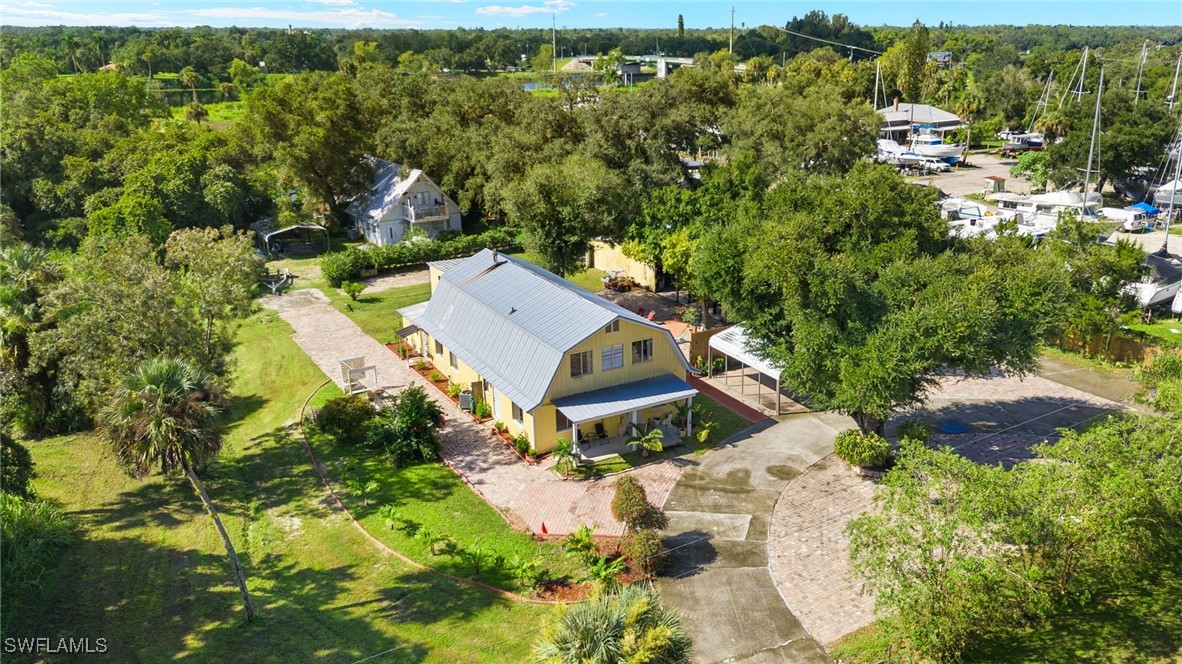 an aerial view of a house with a yard