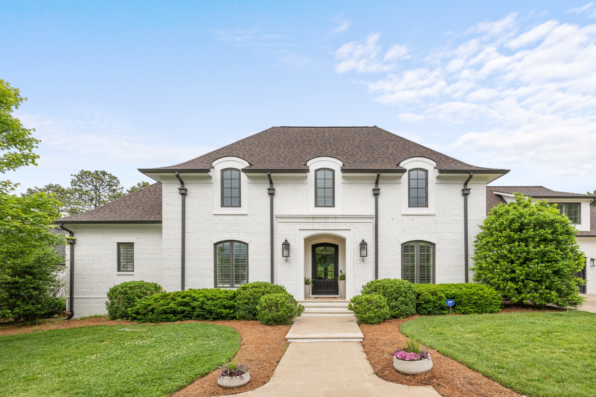 a front view of a house with a yard