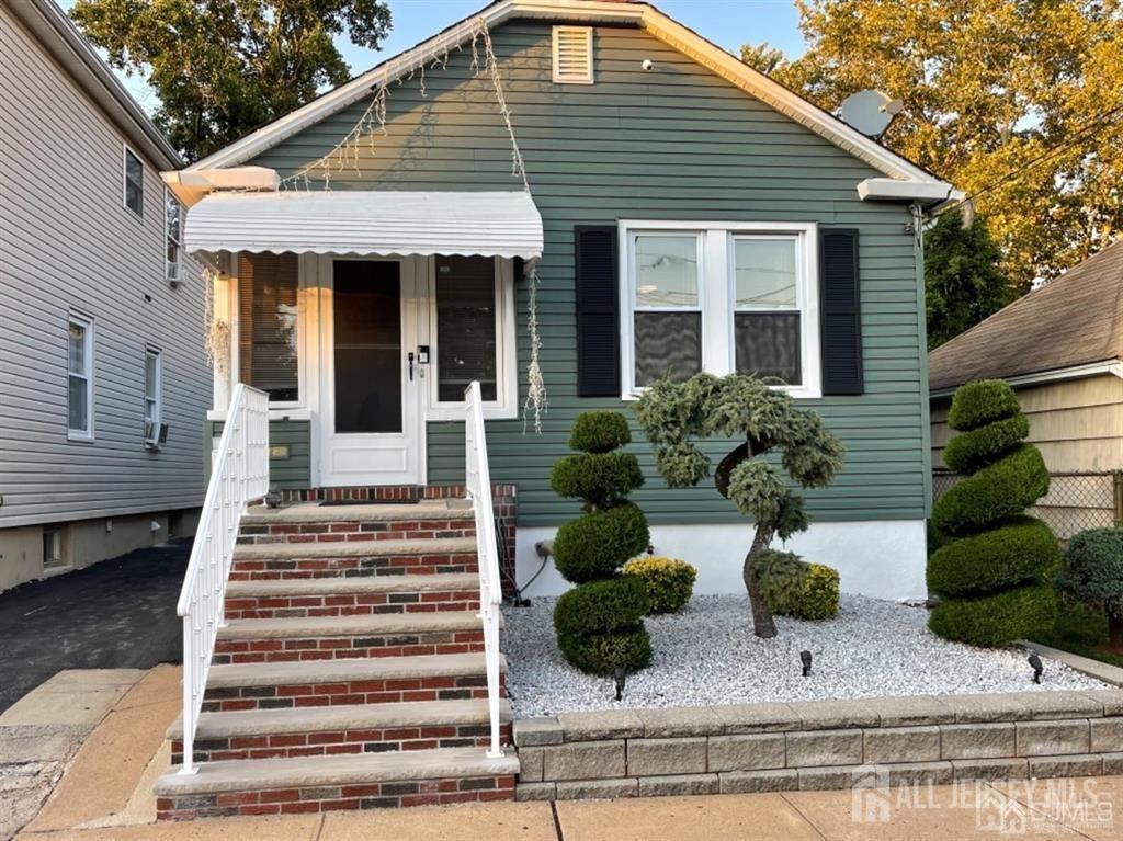 a front view of house with a yard