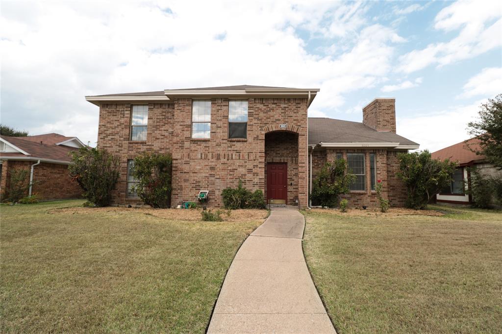 a front view of a house with yard